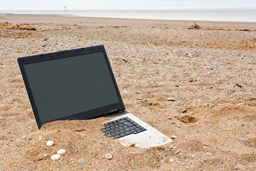 Laptop in sand