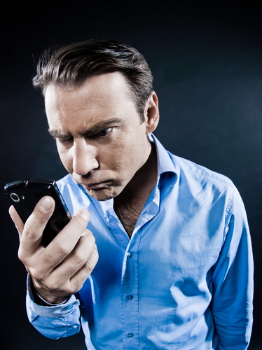 Angry man with smartphone