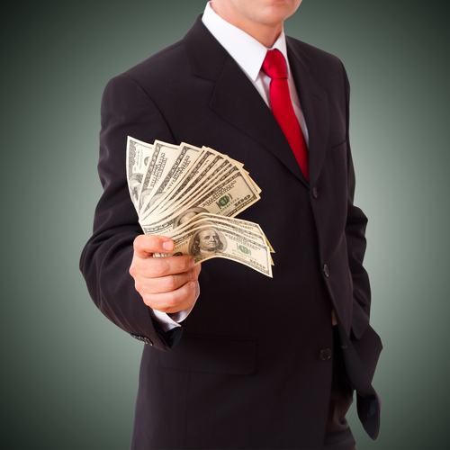 Businessman holding cash