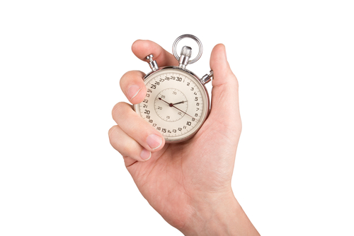 Hand holding stopwatch